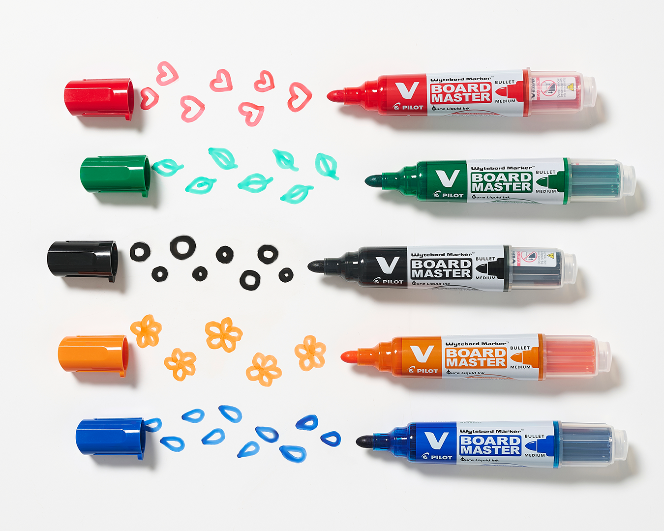 Flatlay of PILOT V Board refillable whiteboard markers in assorted colours