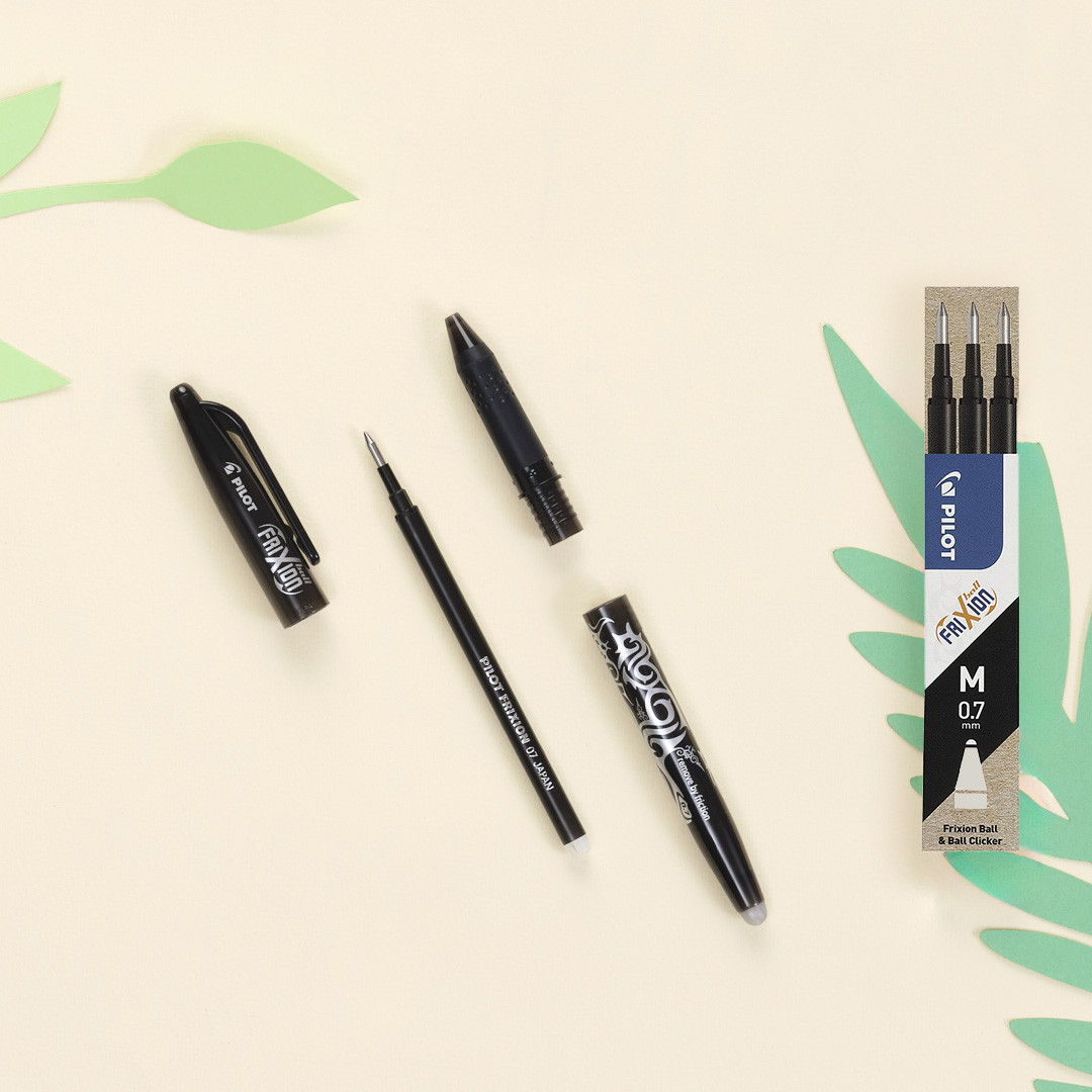 A box of FriXion Erasable Gel Ink Refills for Ball, Pro, and Clicker pens in black, displayed next to the four disassembled pieces of a FriXion Ball Erasable Gel Pen.