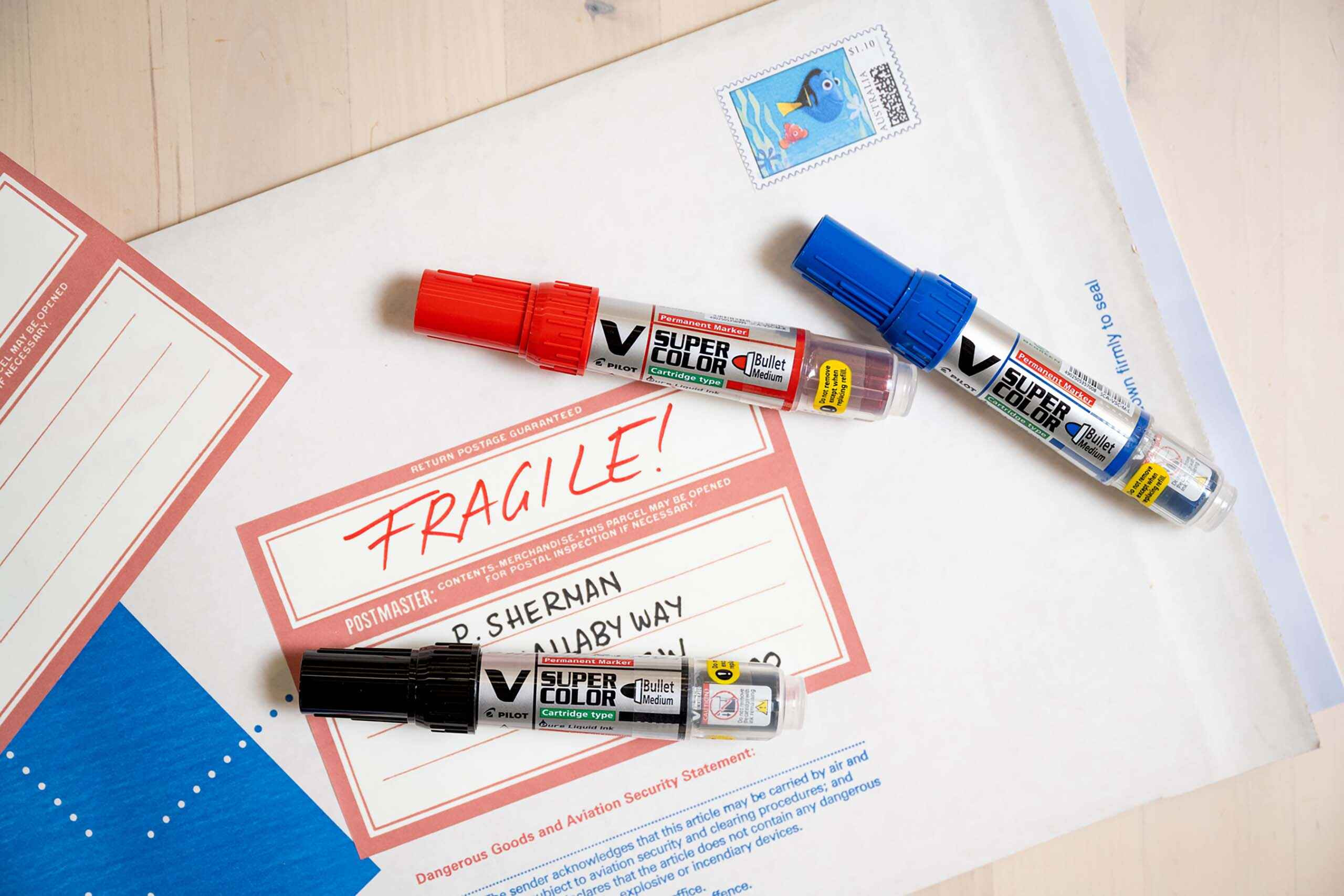 &ldquo;Fragile&rdquo; written in red permanent marker and postal address on envelope. 