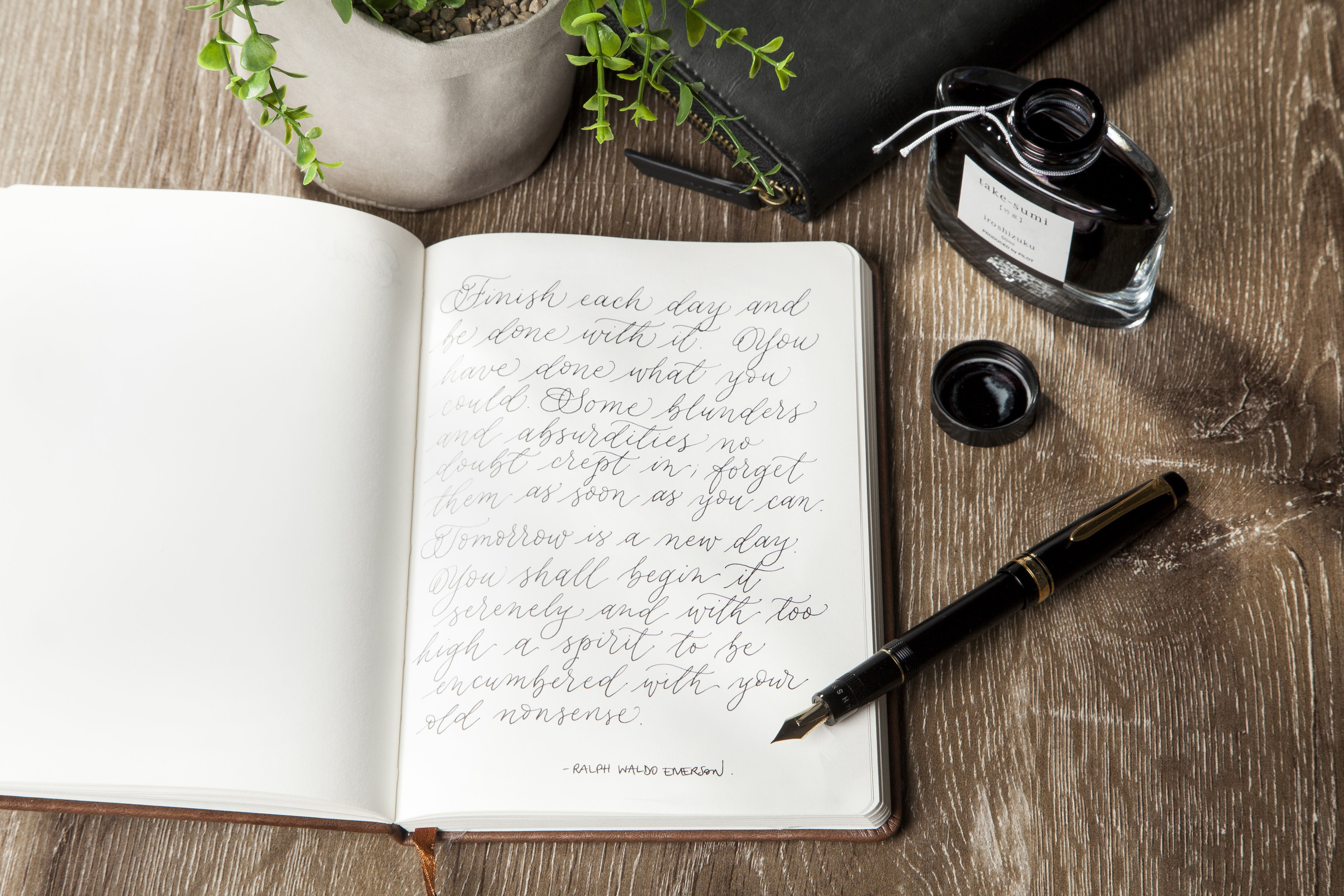A PILOT Justus fountain pen with a handwritten journal entry using iroshizuku ink, highlighting the elegance and precision of fine fountain pen writing