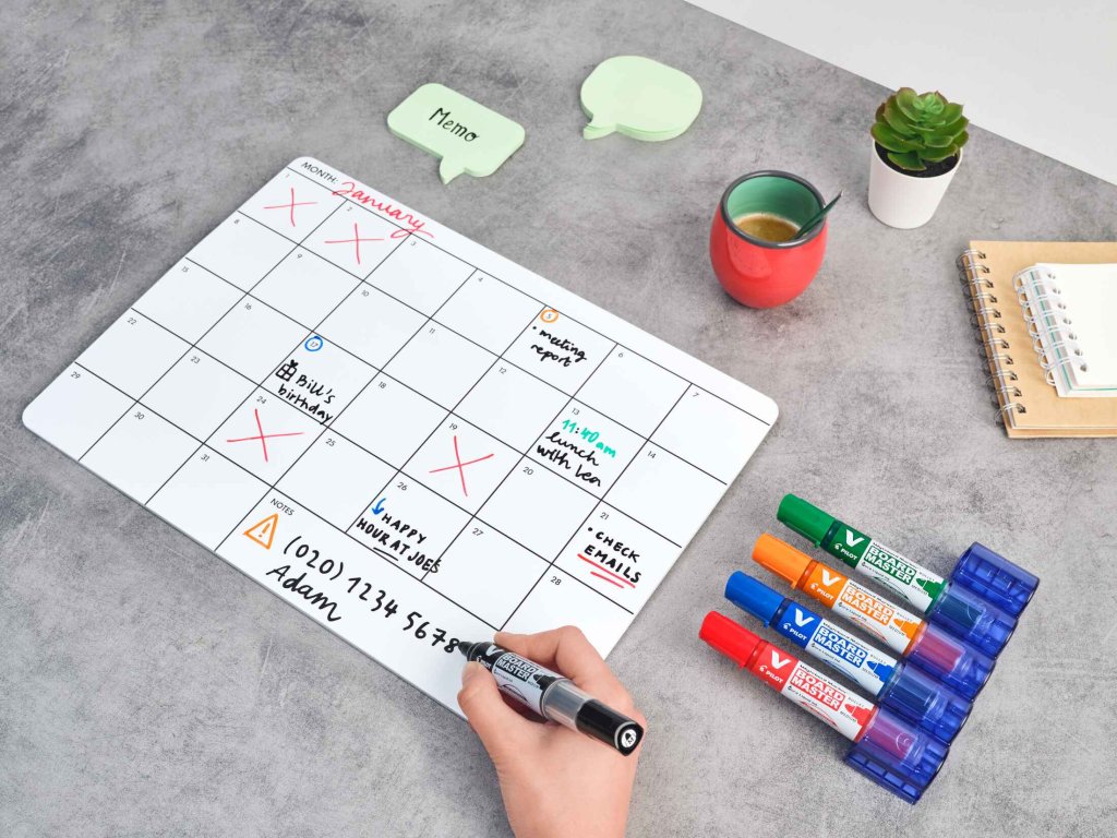A hand drawing of a calendar on a whiteboard using PILOT V Board Master whiteboard marker in black.