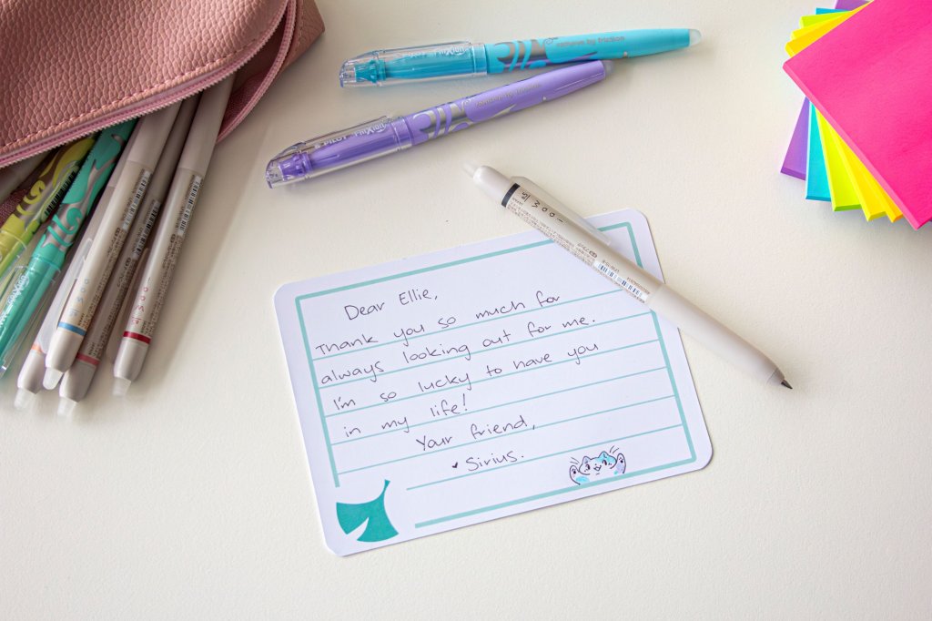 Handwritten thank you note to a friend on a desk with PILOT pens, showing how to write a thank you note.