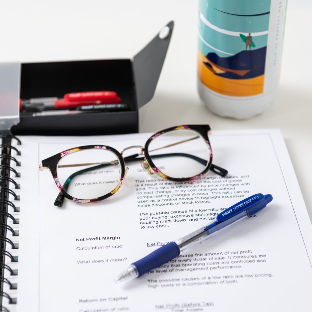 PILOT Pen Everyday Essentials pen Super Grip in blue on a report.